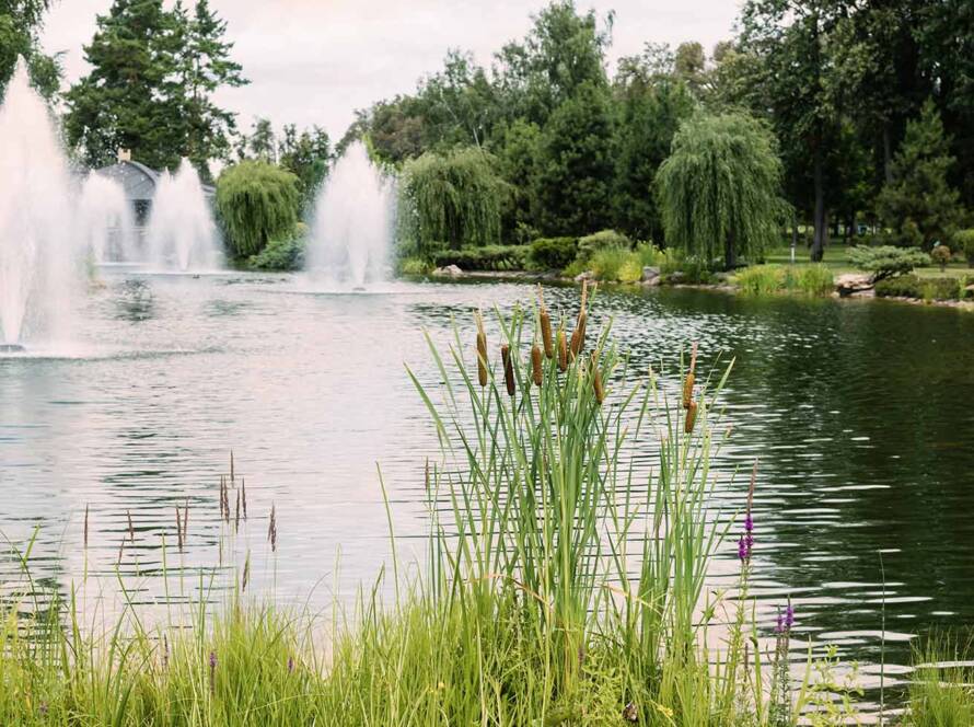 Water fountains shoot into the air at this new jersey pond maintained by United Land and Snow Maintenance