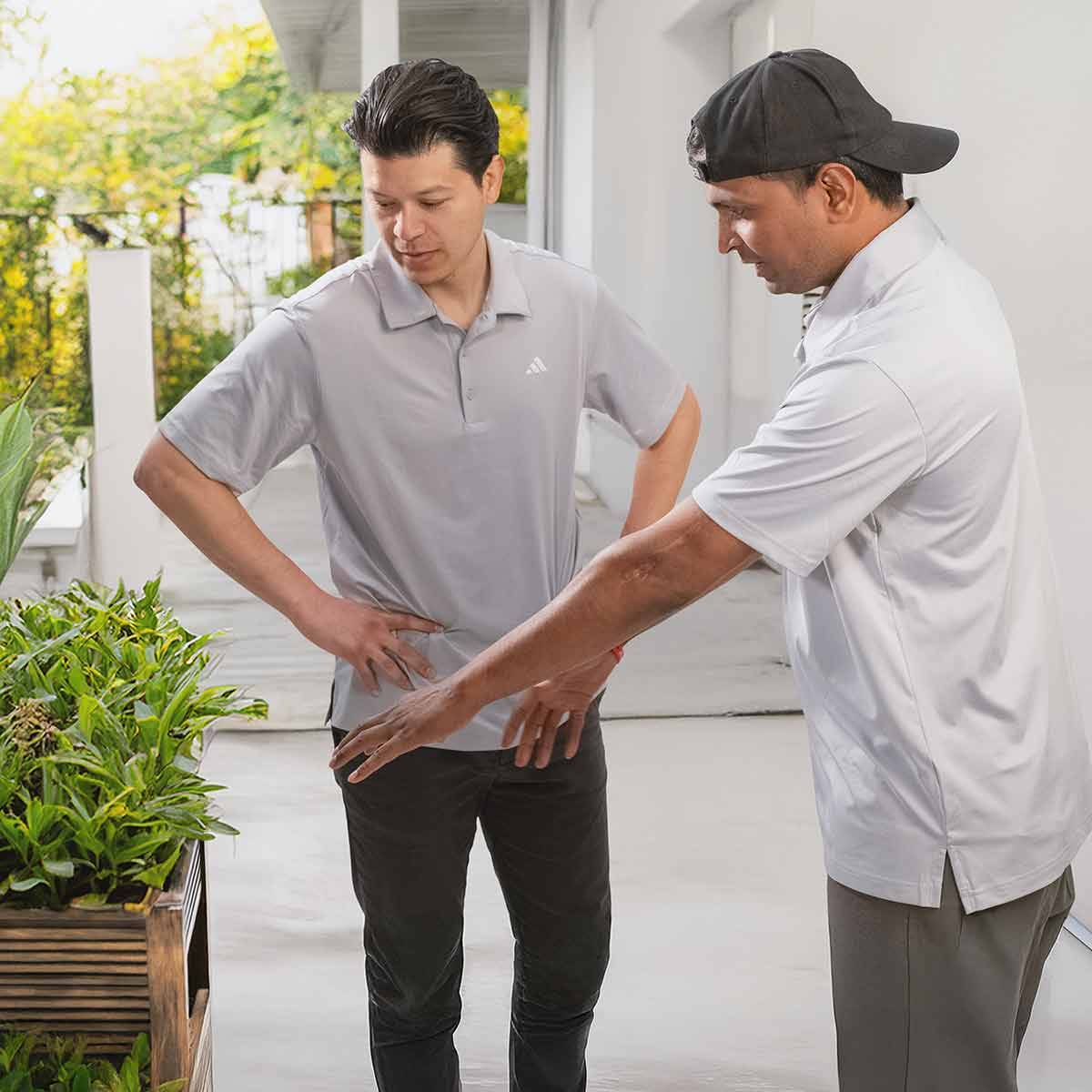 UNITED LAND AND SNOW MAINTENANCE NEW JERSEY LANDSCAPING COMPANY United Land & Snow Management Co-Founders discuss a garden installation.